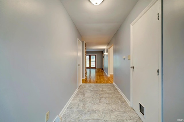 corridor featuring light hardwood / wood-style flooring