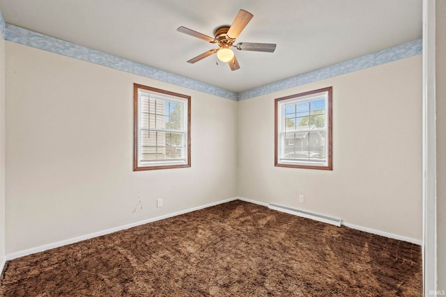 empty room featuring ceiling fan, baseboard heating, and carpet flooring