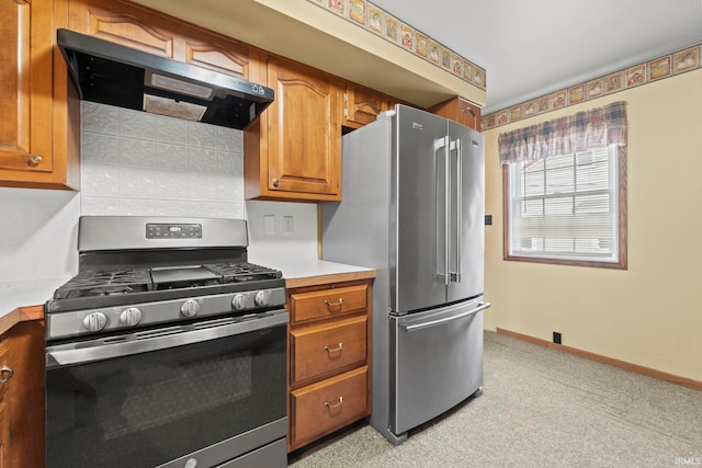 kitchen with appliances with stainless steel finishes, light colored carpet, and exhaust hood