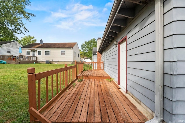 wooden deck with a yard