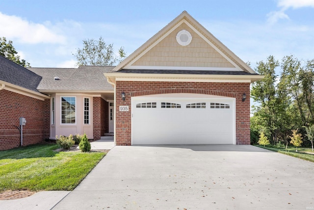 view of front of home featuring a garage and a front lawn