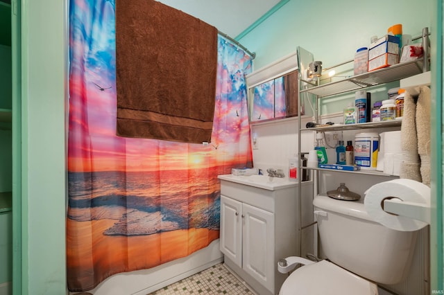 bathroom featuring toilet, shower / bath combo with shower curtain, and tile patterned flooring