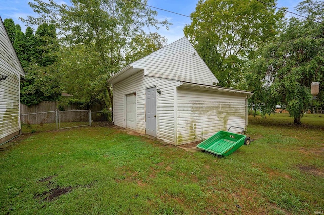 garage featuring a yard