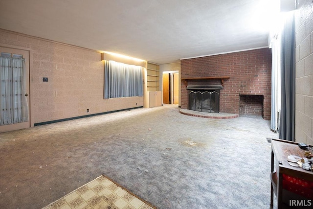 unfurnished living room with a brick fireplace