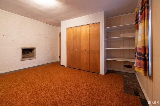 unfurnished bedroom with carpet floors and a closet