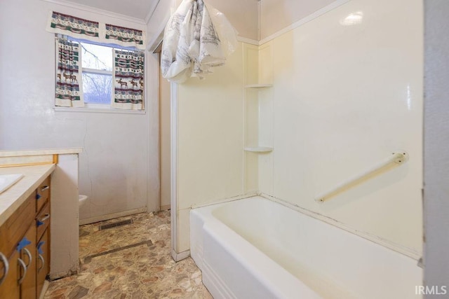 bathroom featuring vanity and independent shower and bath