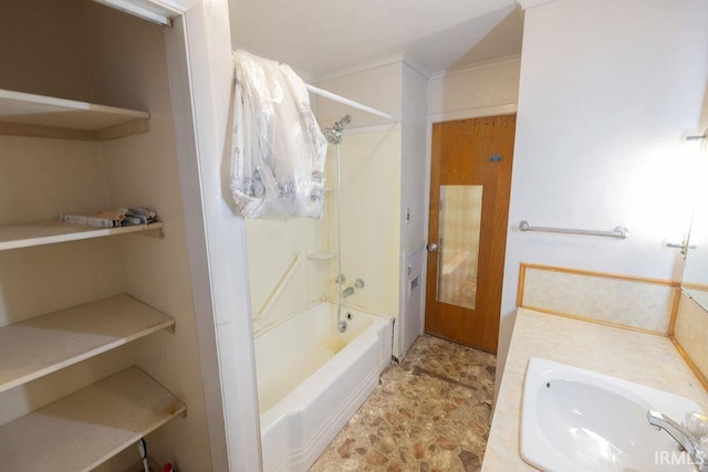 bathroom featuring bathing tub / shower combination and vanity