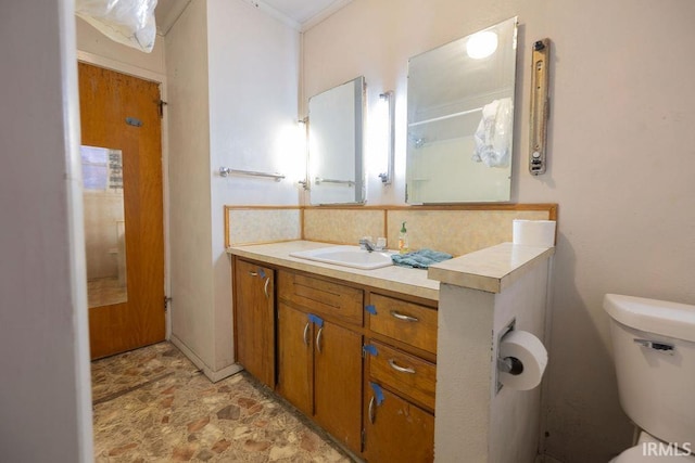 bathroom with vanity and toilet