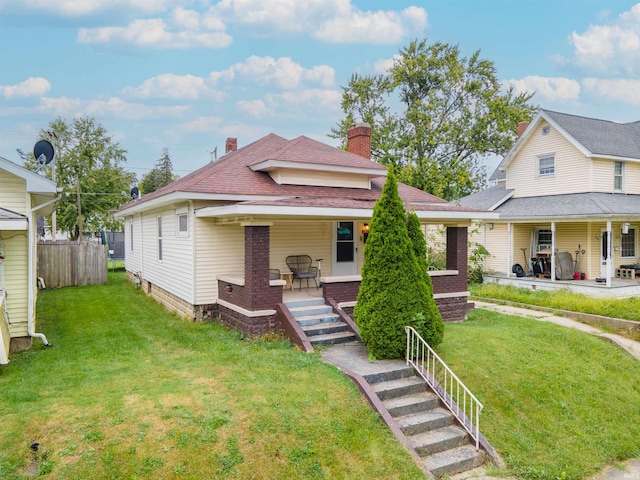 view of front of home featuring a porch and a front yard