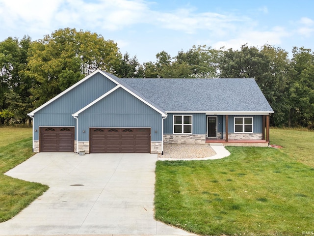 view of front of home featuring a garage and a front lawn