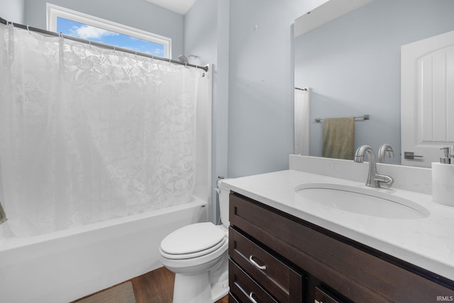 full bathroom with vanity, toilet, and shower / tub combo with curtain