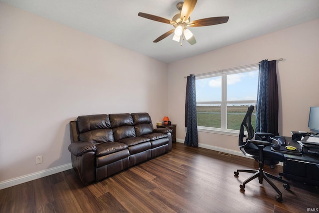 office space featuring ceiling fan and dark hardwood / wood-style floors