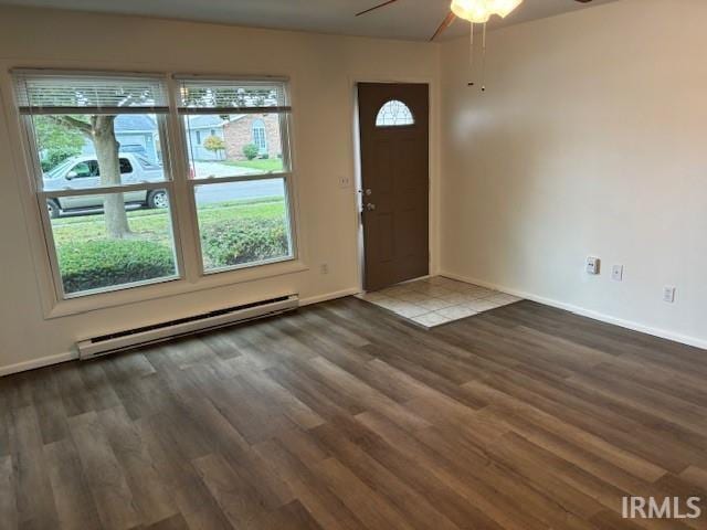 foyer entrance with ceiling fan, baseboard heating, and hardwood / wood-style floors