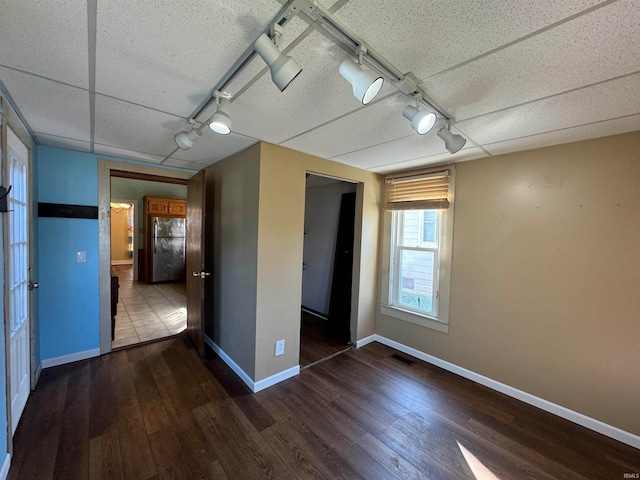 empty room featuring dark hardwood / wood-style flooring