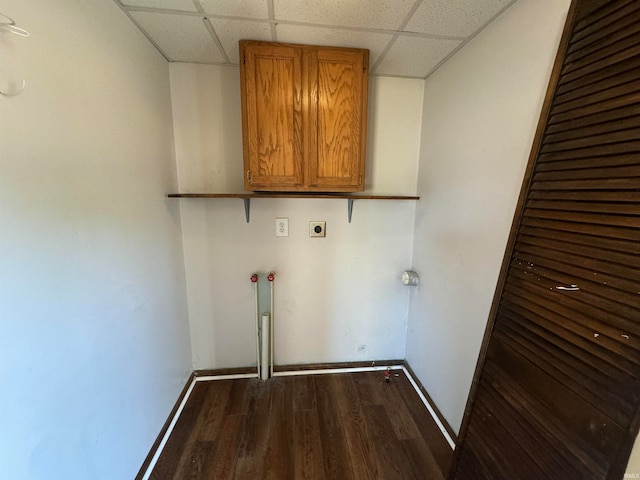 washroom with cabinets, dark wood-type flooring, and electric dryer hookup