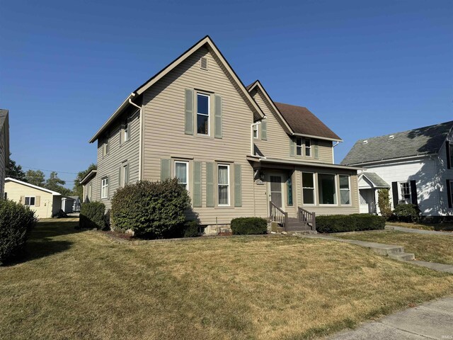 232 S Main St, Avilla, IN 46710 - traditional home featuring a front lawn