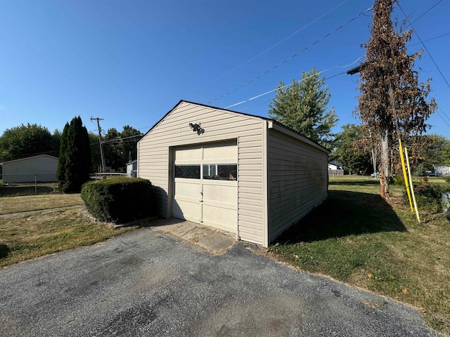 garage featuring a yard