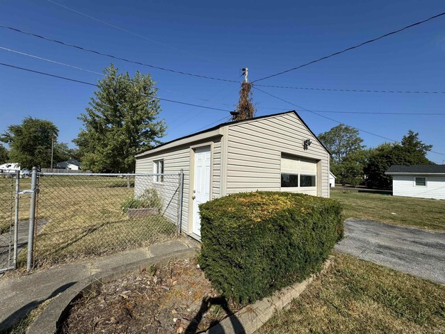 232 S Main St, Avilla, IN 46710 - view of outbuilding with an outbuilding and fence
