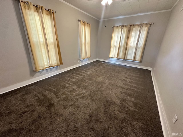 carpeted spare room with ornamental molding and ceiling fan