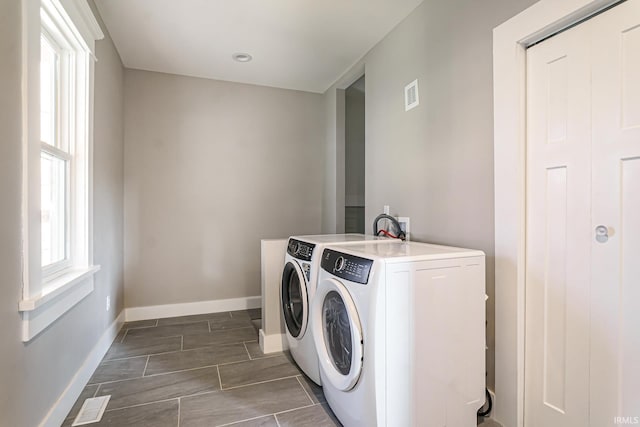 washroom featuring washing machine and clothes dryer