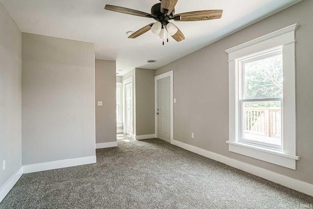 interior space with ceiling fan