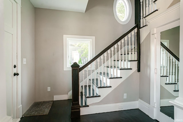 entryway with dark hardwood / wood-style floors