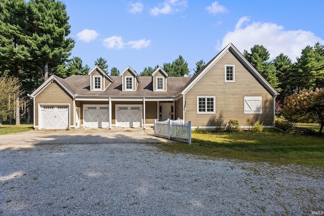 new england style home with a garage