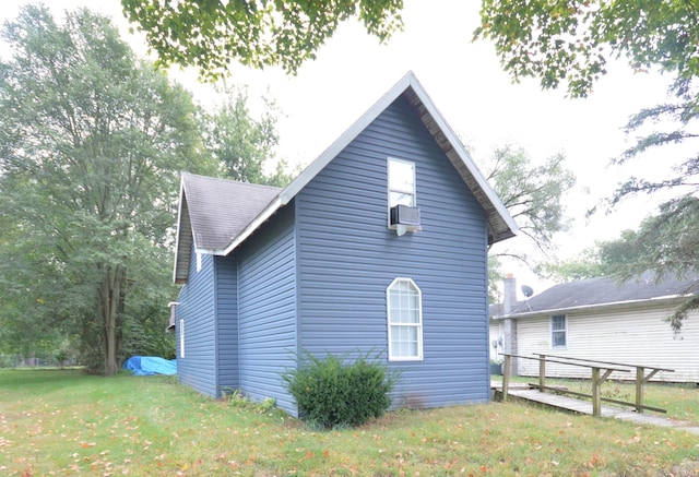 view of property exterior with a lawn