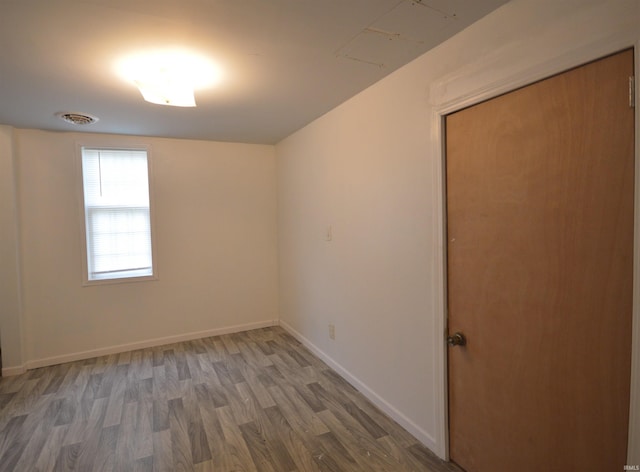 spare room featuring hardwood / wood-style flooring