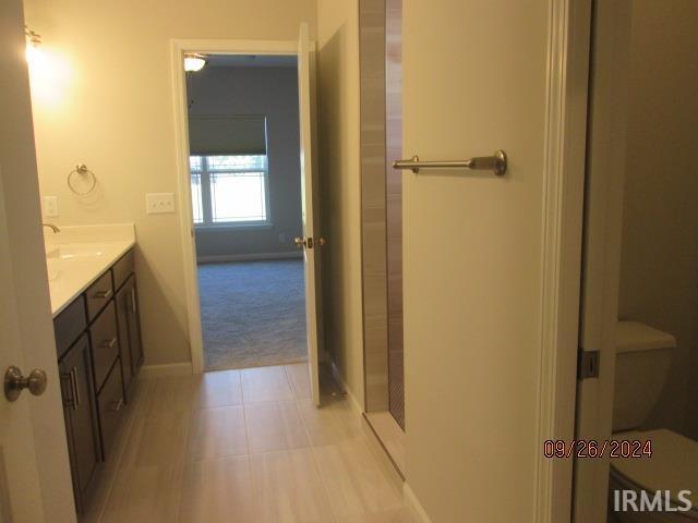 2159 Maple Leaf Dr, Kokomo, IN 46902 - full bath featuring vanity, baseboards, and tile patterned flooring
