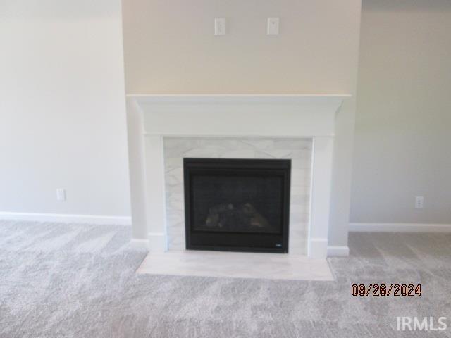 2159 Maple Leaf Dr, Kokomo, IN 46902 - detailed view of carpet flooring, a fireplace, and baseboards