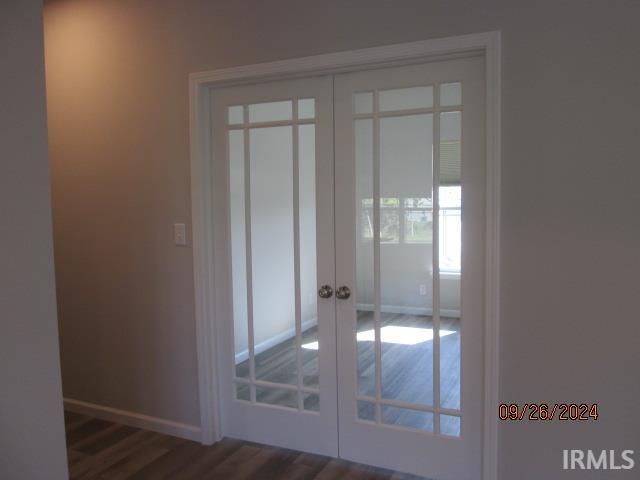 2159 Maple Leaf Dr, Kokomo, IN 46902 - doorway to outside with french doors, baseboards, and dark wood-type flooring