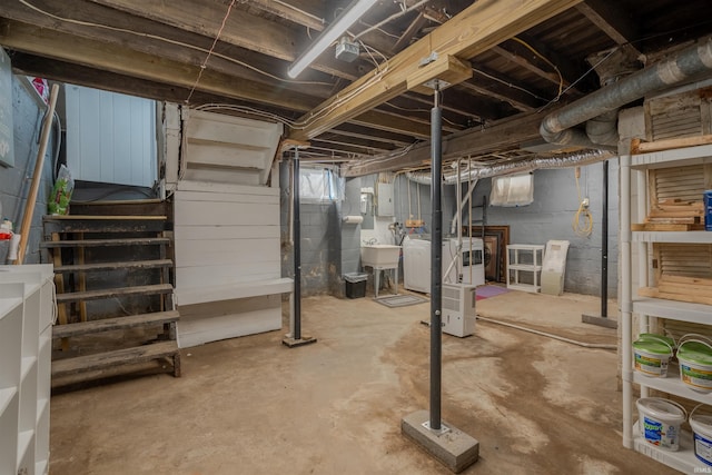 basement with sink and washer and clothes dryer