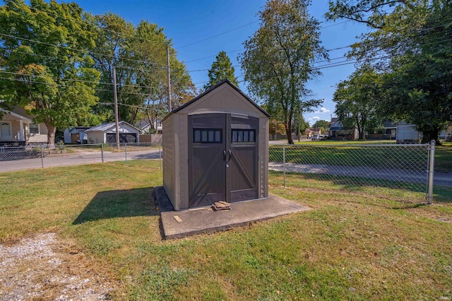 view of outbuilding featuring a lawn