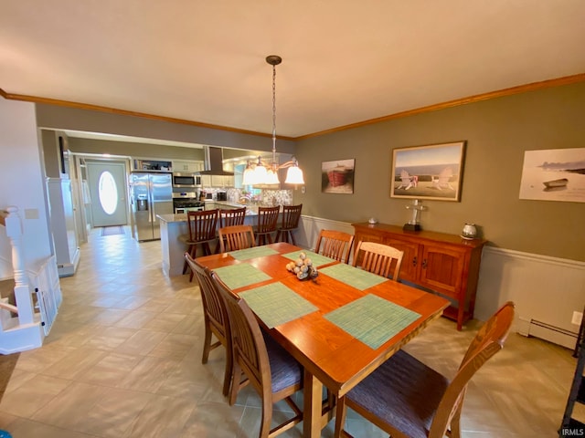 dining room featuring ornamental molding, a notable chandelier, and baseboard heating