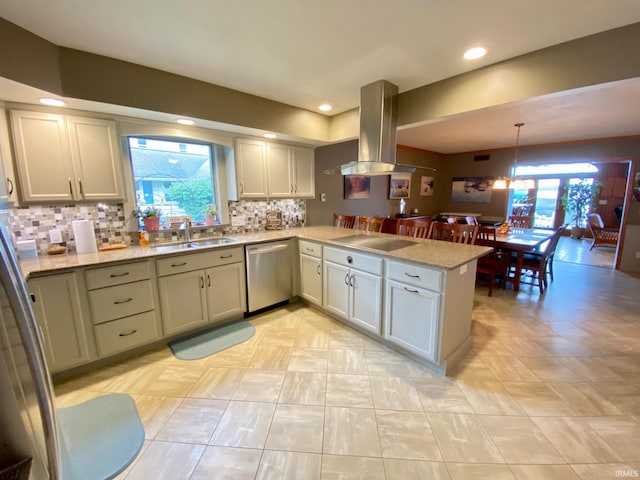 kitchen with pendant lighting, sink, kitchen peninsula, stainless steel dishwasher, and island exhaust hood