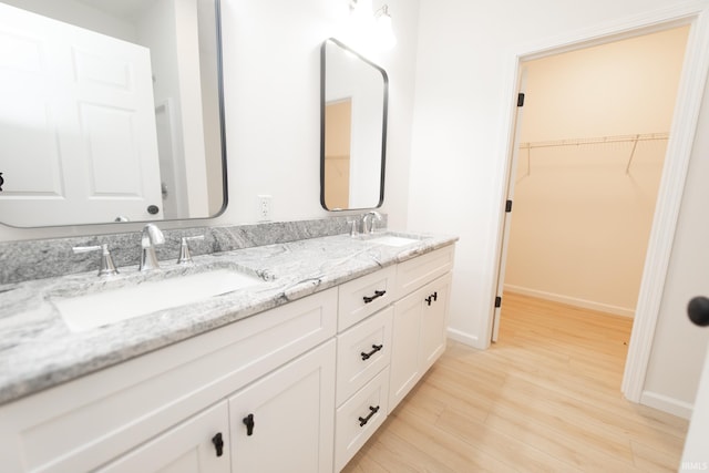 bathroom featuring vanity and hardwood / wood-style flooring