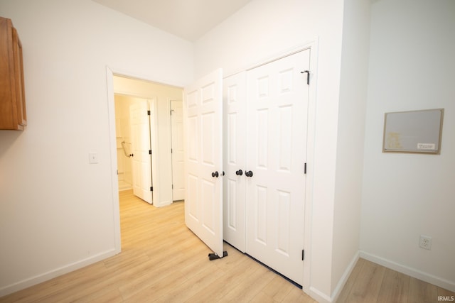 corridor featuring light hardwood / wood-style floors