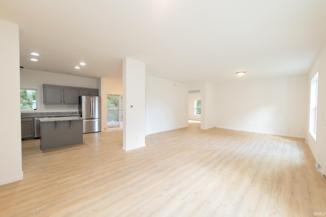 unfurnished living room featuring light hardwood / wood-style floors