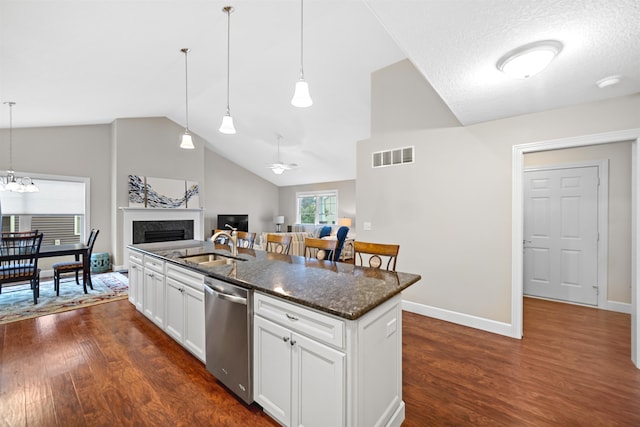 kitchen featuring a center island with sink, stainless steel dishwasher, dark hardwood / wood-style flooring, and white cabinets