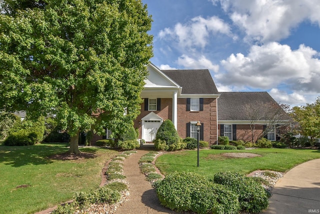 neoclassical home with a front lawn