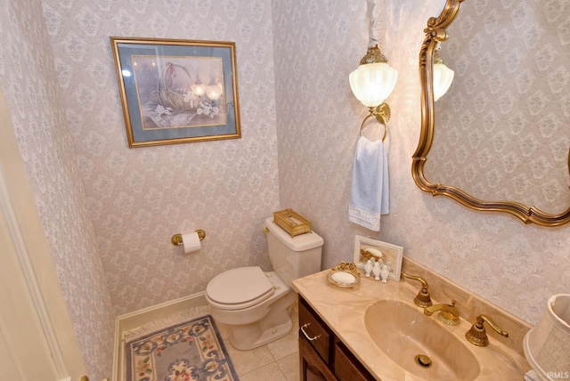 bathroom with tile patterned flooring, vanity, and toilet