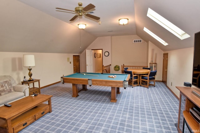 recreation room featuring carpet flooring, vaulted ceiling with skylight, ceiling fan, and billiards