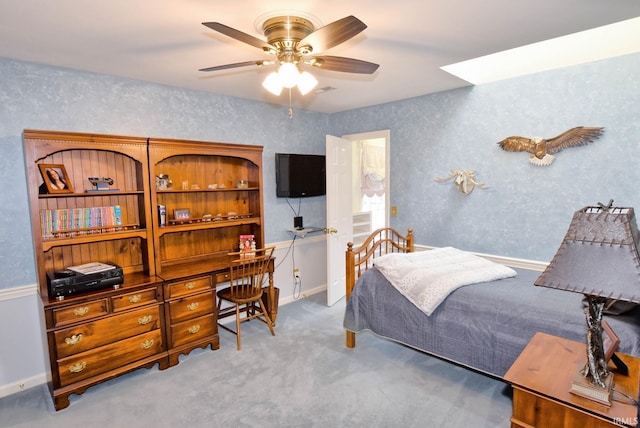 bedroom with light carpet and ceiling fan