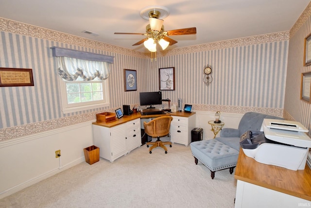 office space with ceiling fan and light carpet