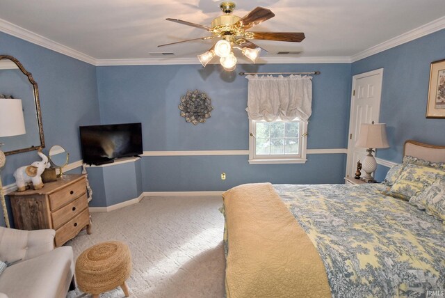 bedroom with ceiling fan, carpet floors, and ornamental molding