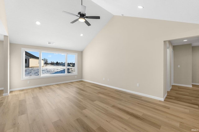 unfurnished living room with ceiling fan, lofted ceiling, and light wood-type flooring