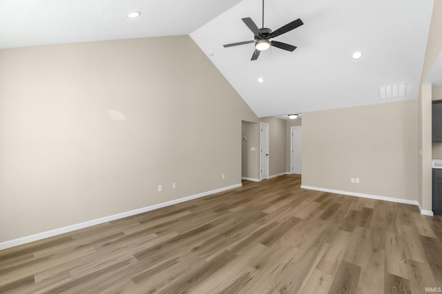 unfurnished living room with lofted ceiling, ceiling fan, and light wood-type flooring