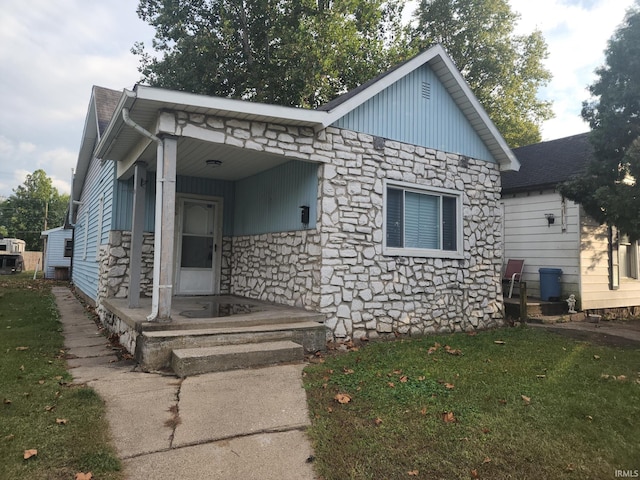 bungalow with a front lawn