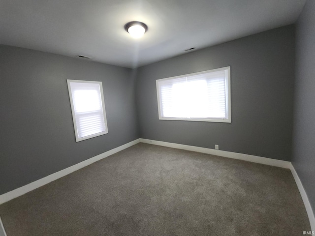 spare room featuring carpet